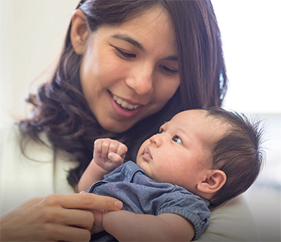 mother holding her baby in her arms